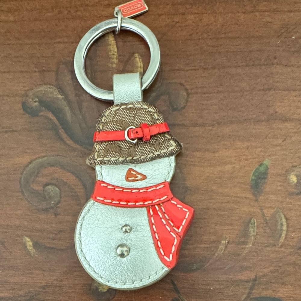 Coach Silver Snowman Keychain with Red Details